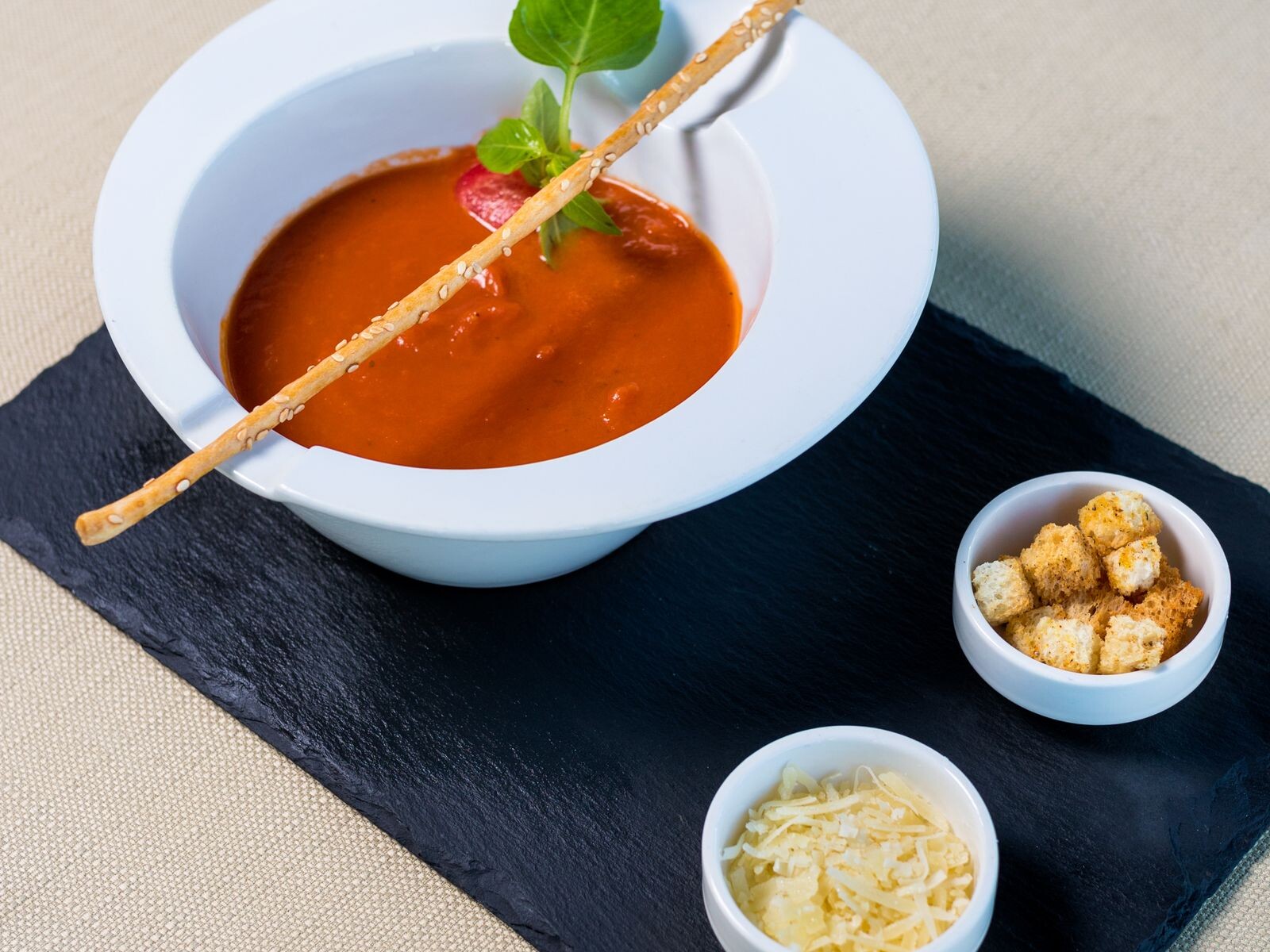 Bowl of tomato soup with croutons