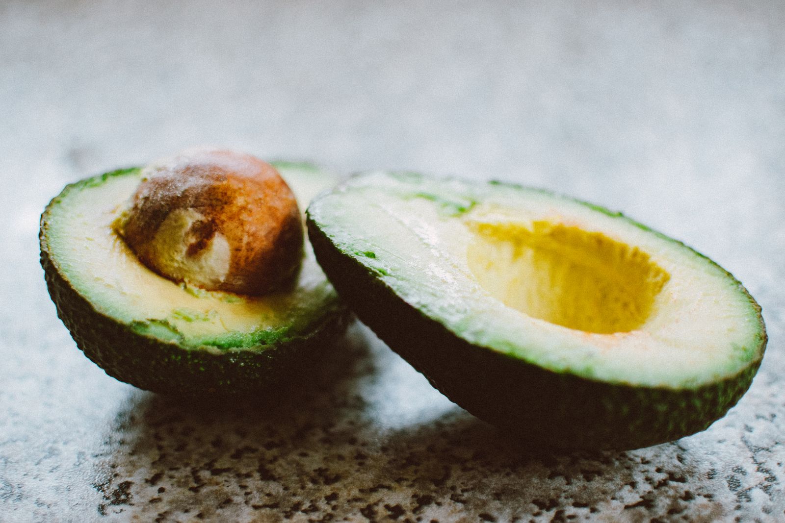 Halved ripe avocado