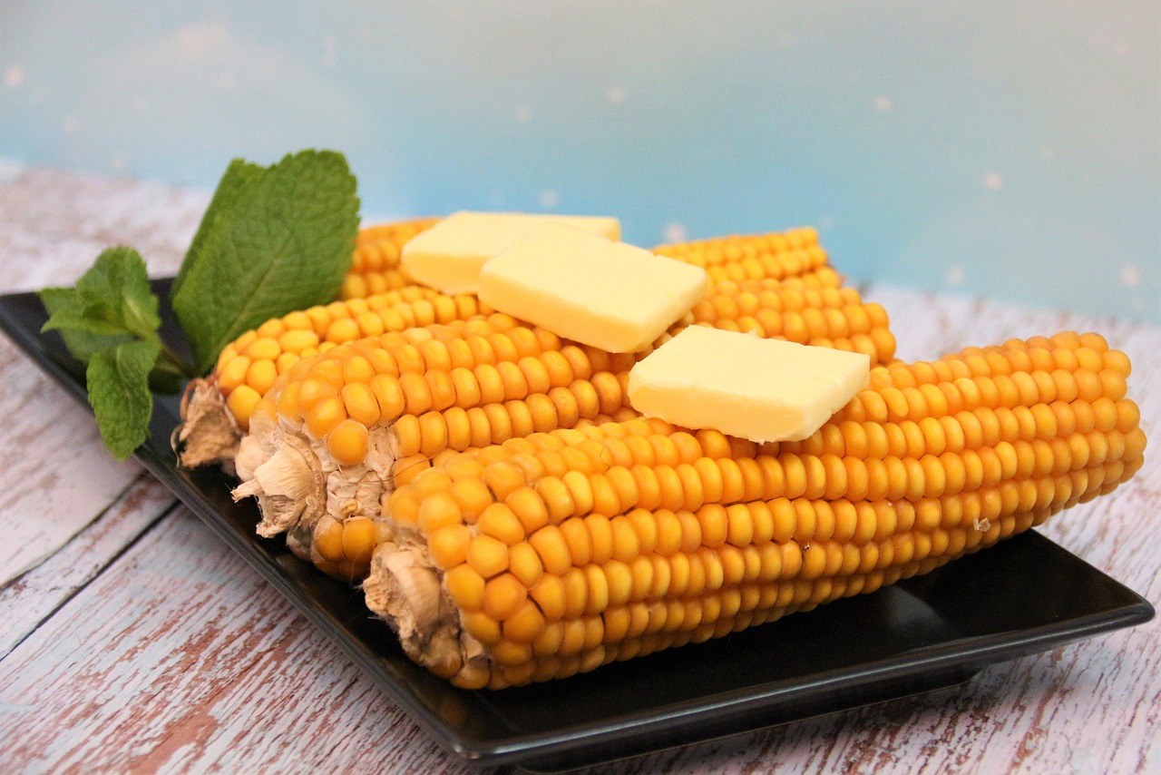 Corn on the cob with pats of butter