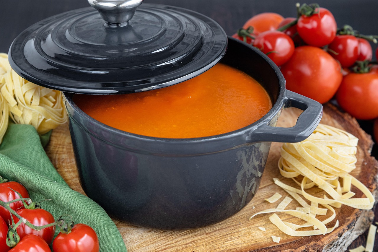 Pot of quick pantry tomato soup with fresh tomatoes