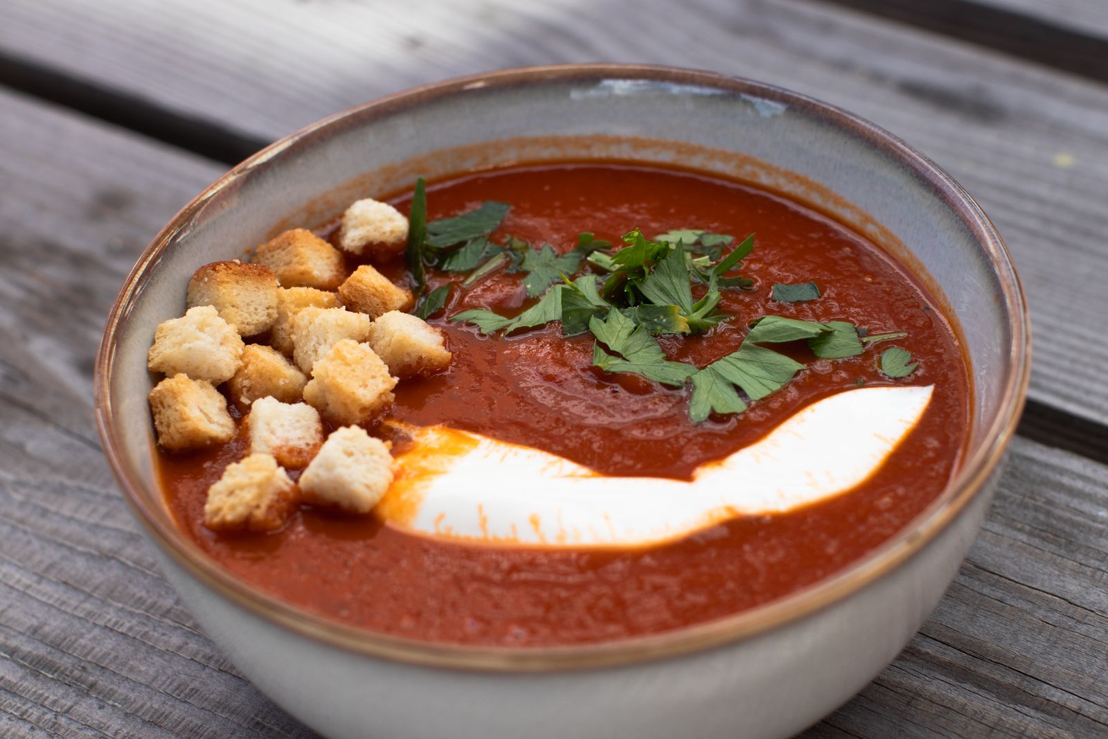 Roasted tomato basil soup with croutons and a swirl of cream
