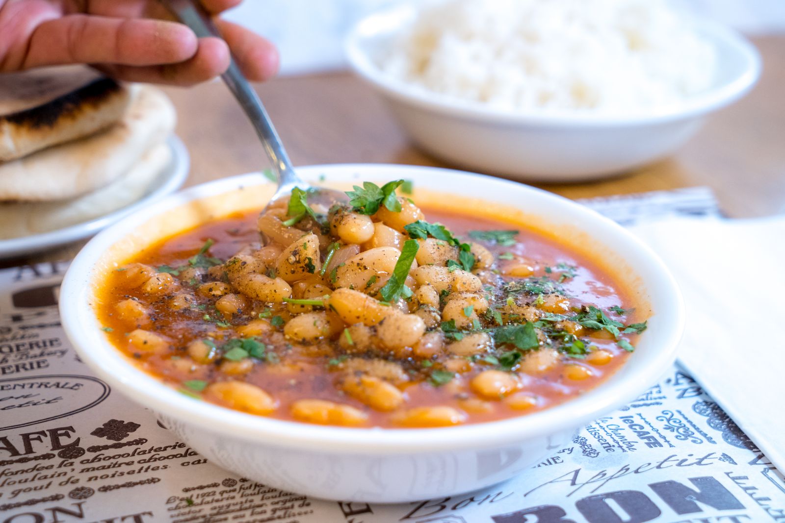 Hearty bowl of cannellini beans in a red broth