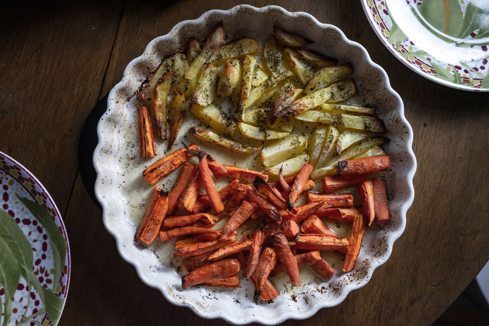 Roasted carrots with herbs in a round dish