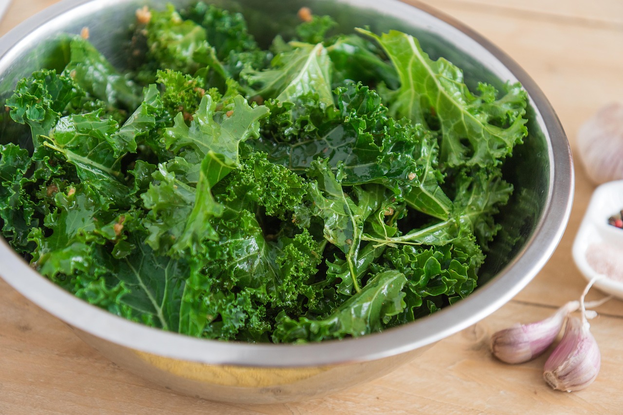 Fresh kale in a bowl for a lower sugar Thanksgiving salad