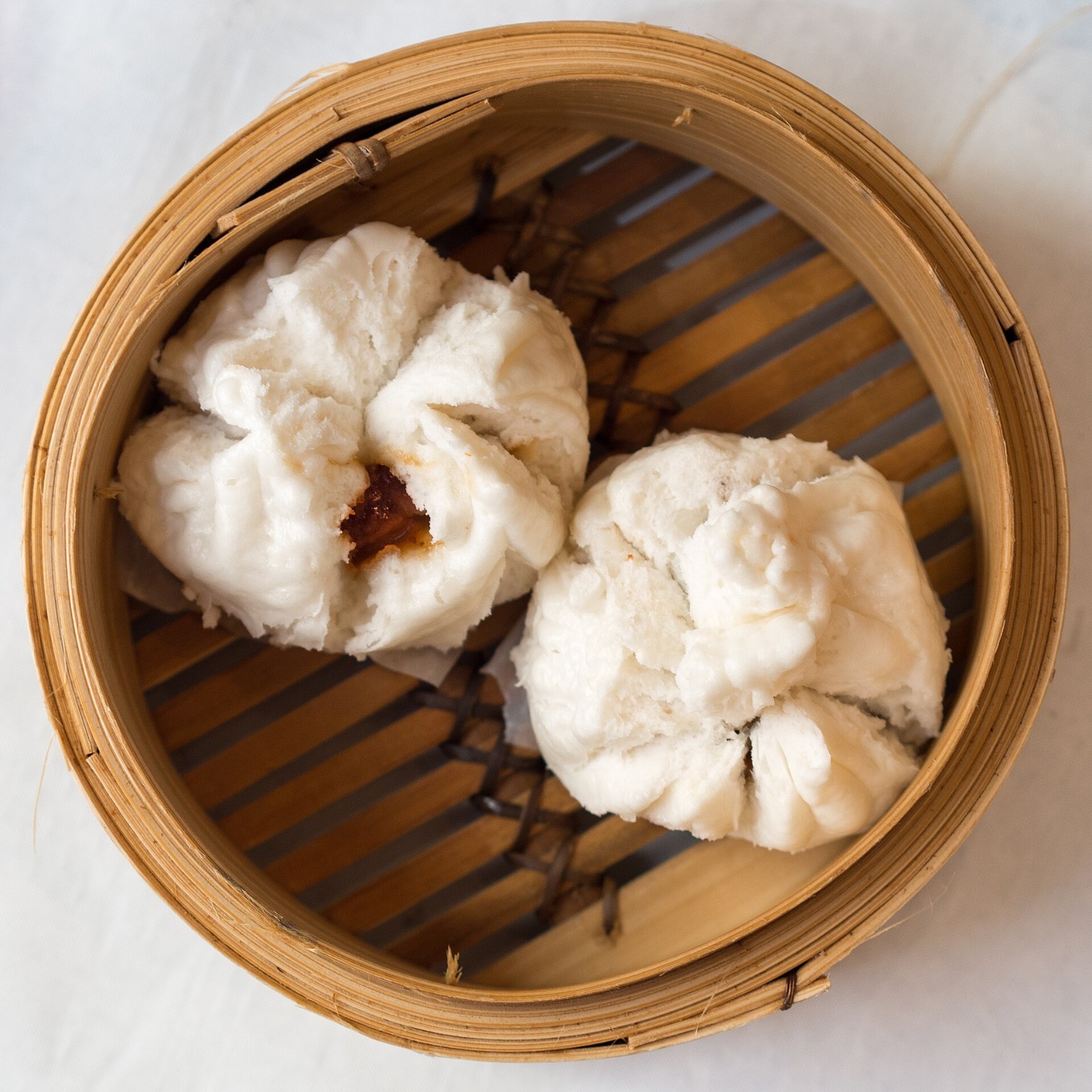 Cha siu bao, a favorite Cantonese food, in a bamboo steamer