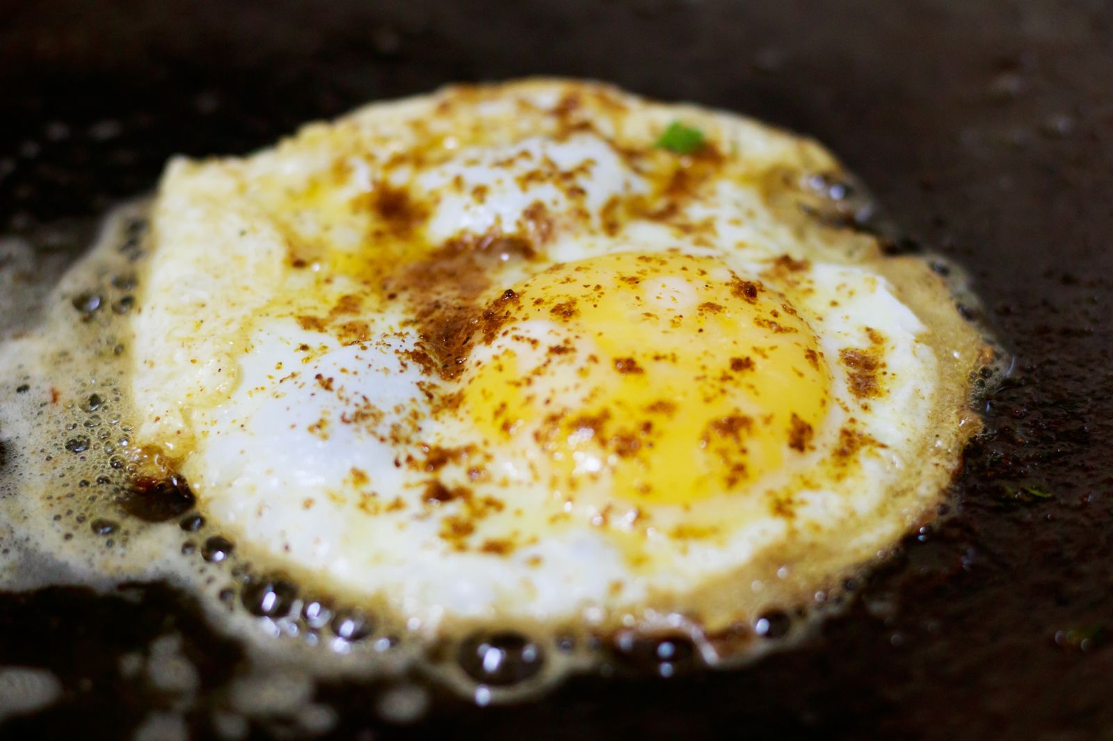 Crispy fried egg with chili seasoning, one of the easiest chili crisp recipes