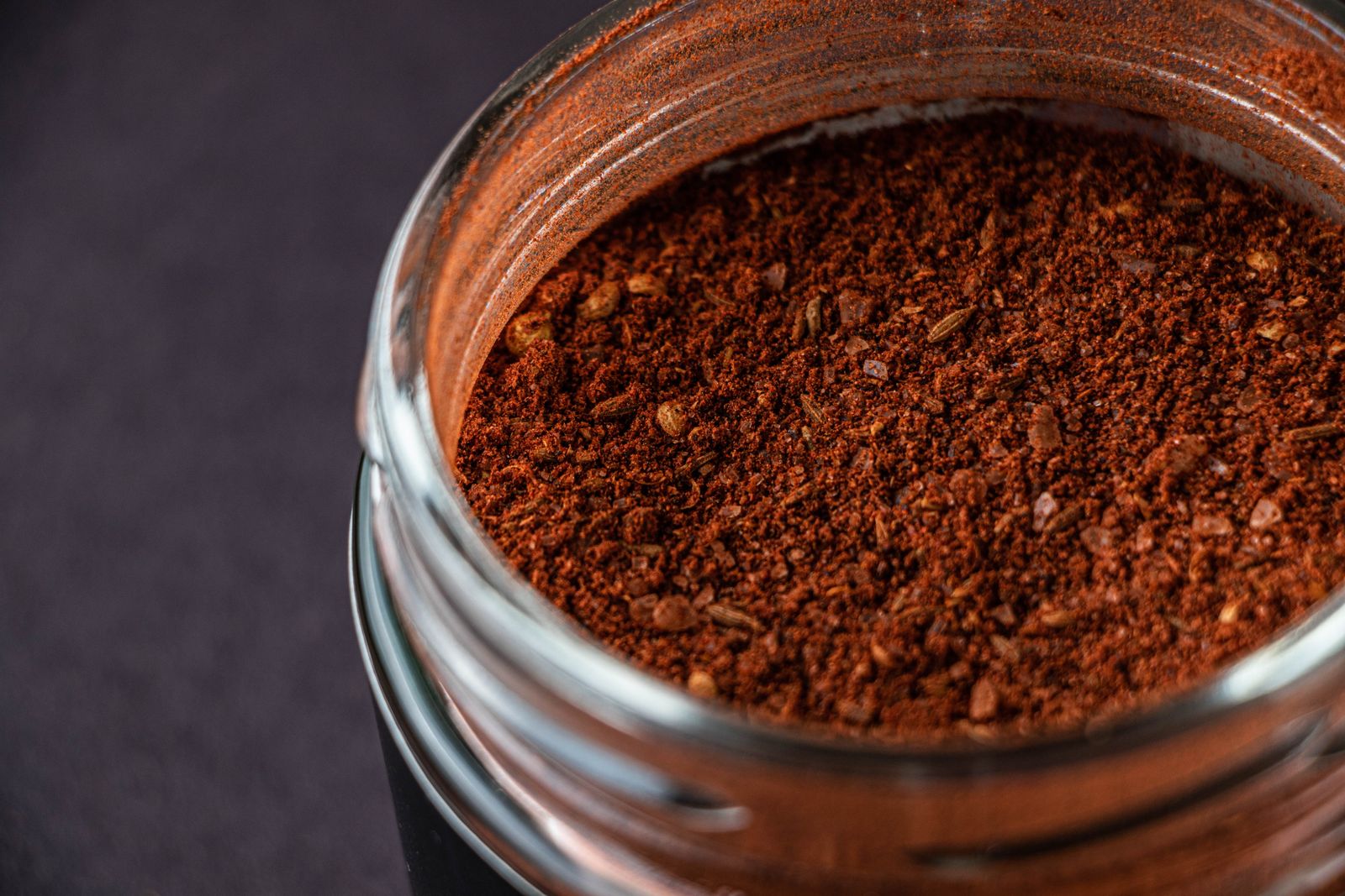Chili flakes in a glass jar for homemade chili crisp recipes
