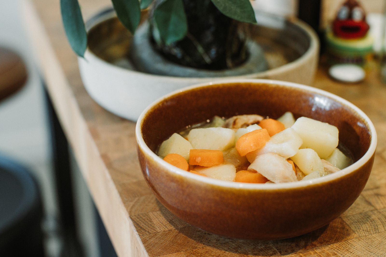 A rustic bowl of potato soup, one of the cheapest Depression era dinners