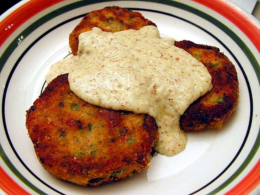 Golden salmon patties with creamy sauce