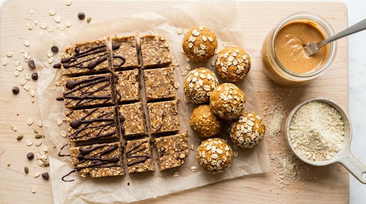 Homemade protein bars with chocolate drizzle and pumpkin protein balls