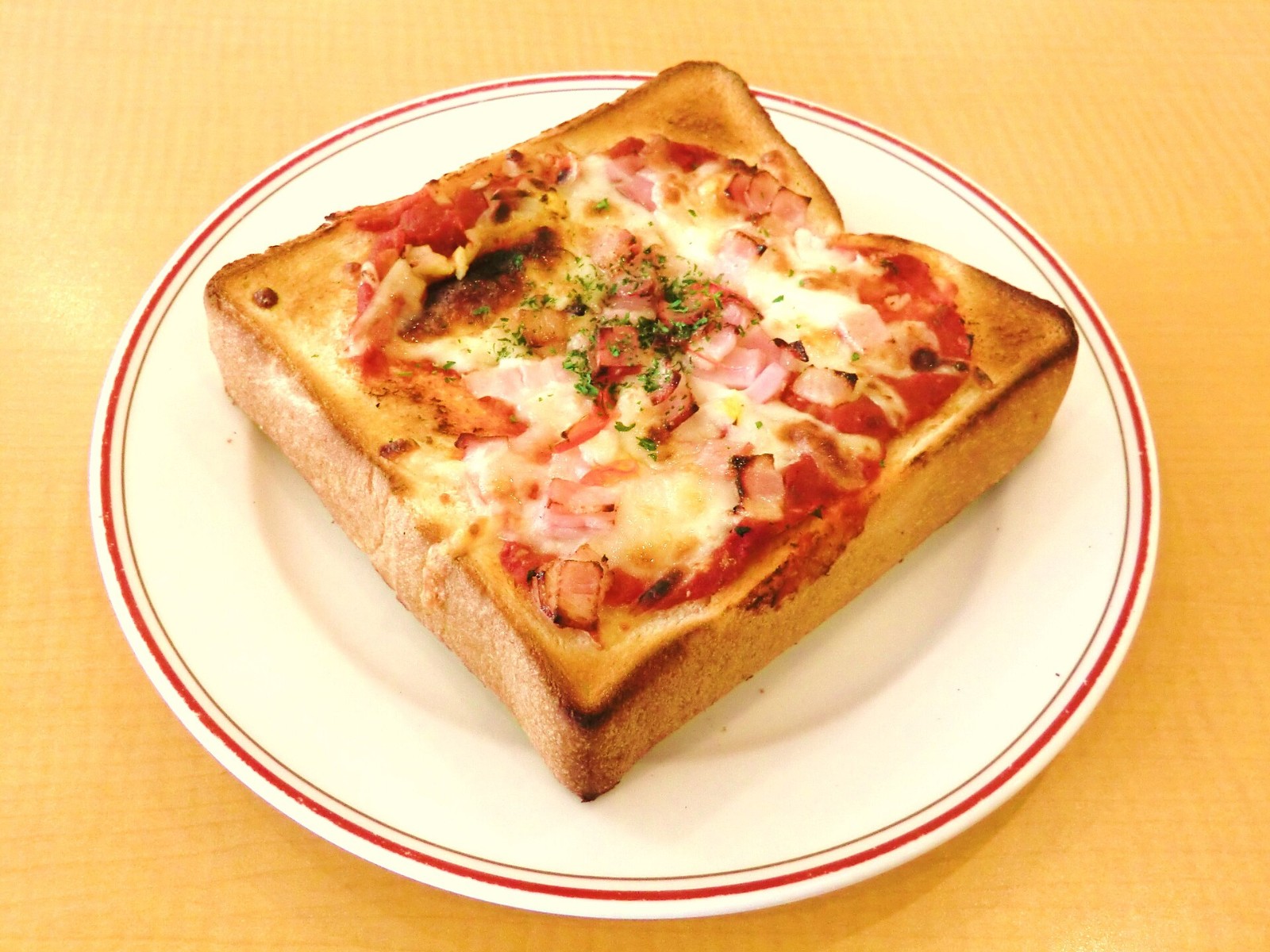 Pizza flavored dinners from Japan: thick square of toast topped with tomato sauce, ham, peppers and melted bubbly cheese