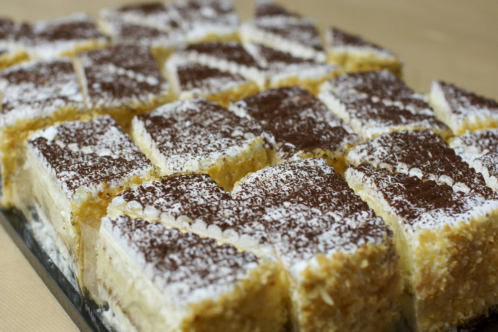 Squares of spiced sheet cake with a sugar dusting