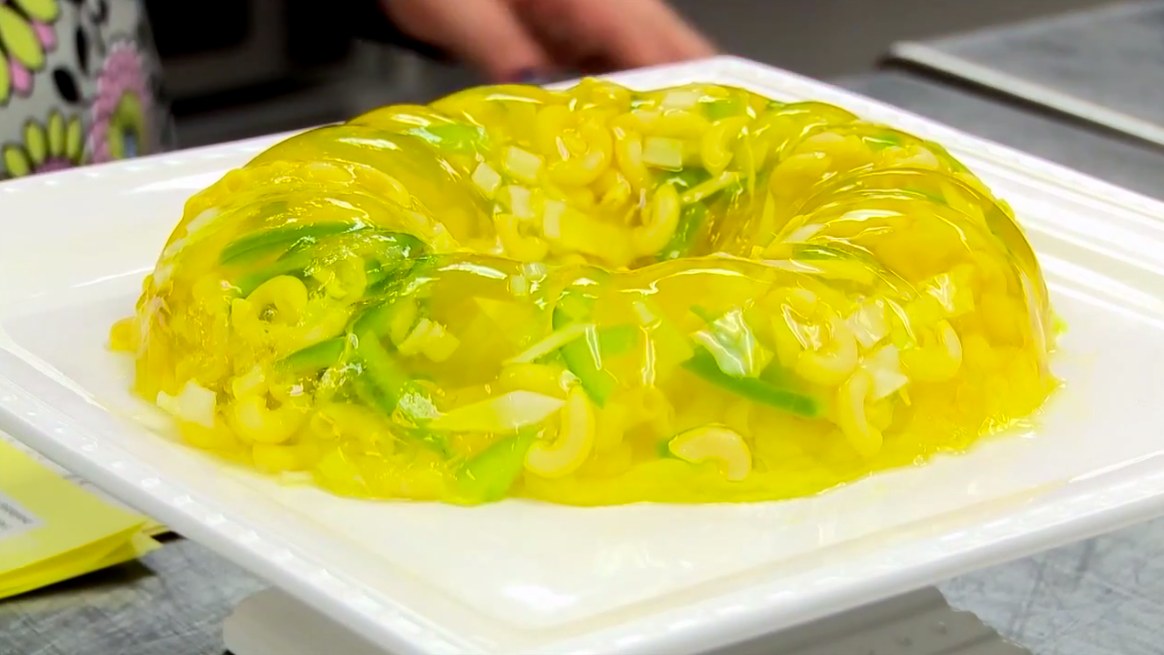 Lime gelatin salad mold with vegetables