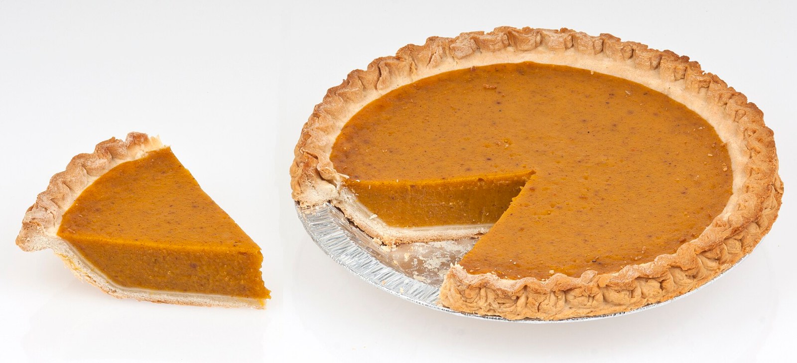Thanksgiving foods: a whole pumpkin pie with one slice cut