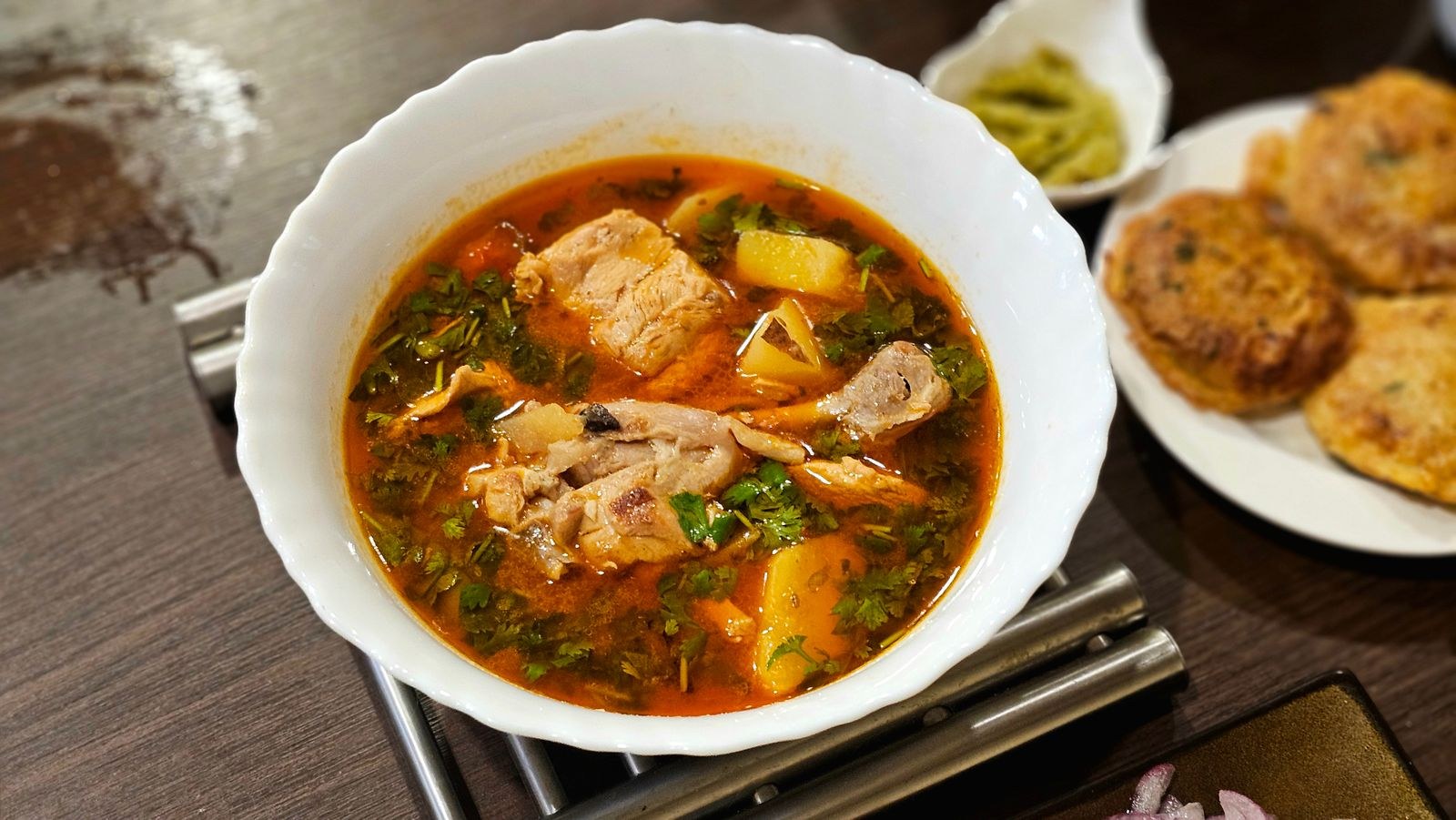 Dutch oven recipes: a bowl of chicken stew with fluffy biscuits