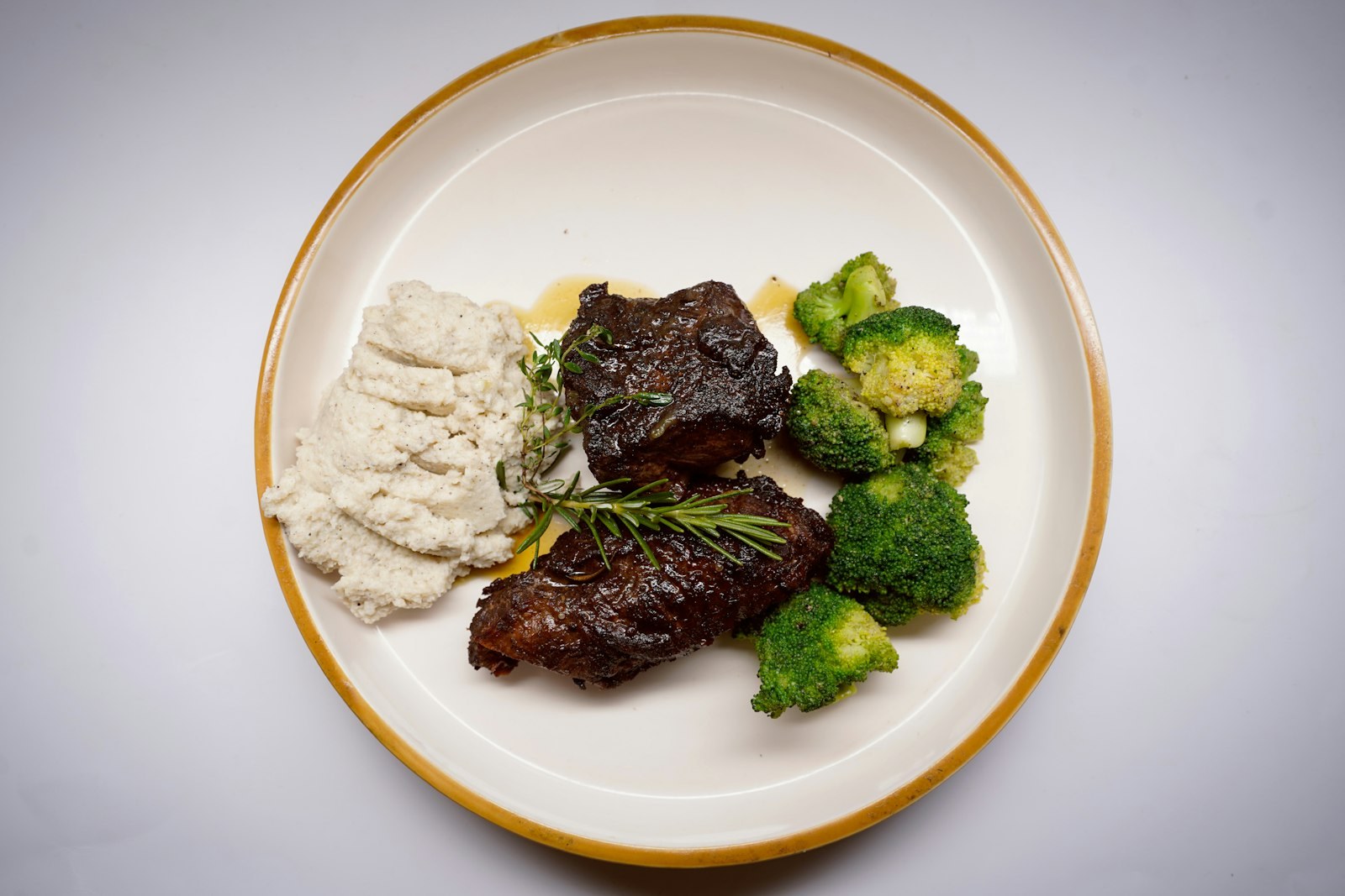 Dutch oven recipes: a braised short rib with mashed potatoes and broccoli