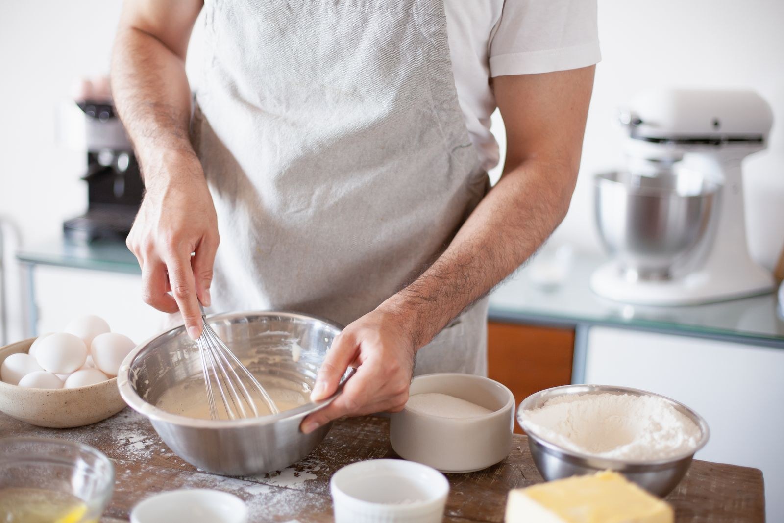 Whipping egg whites by hand in a mixing bowl