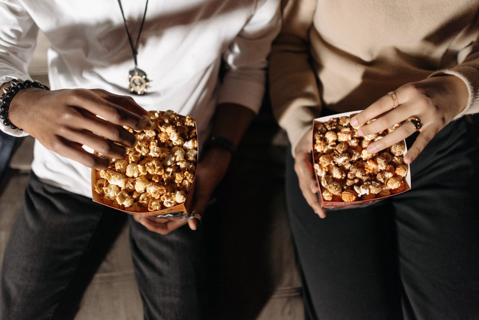 Hands holding sweet homemade popcorn treats
