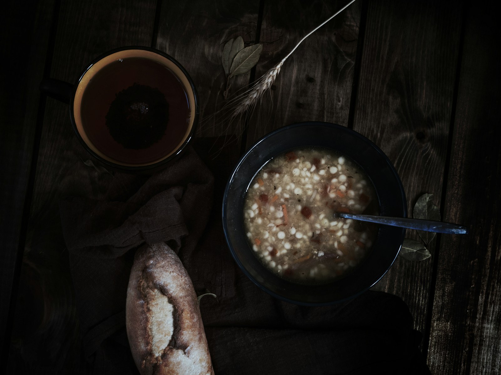 Bowl of hearty barley supper on a rustic table