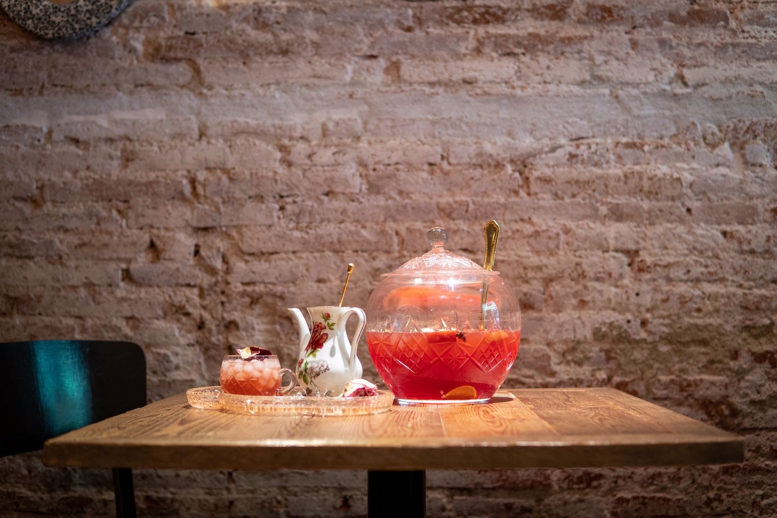 Holiday punch with fruit in a glass pitcher