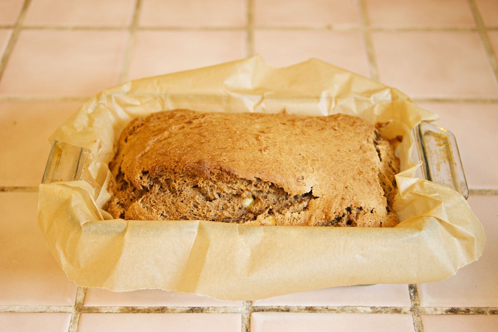 Banana bread in a parchment-lined pan