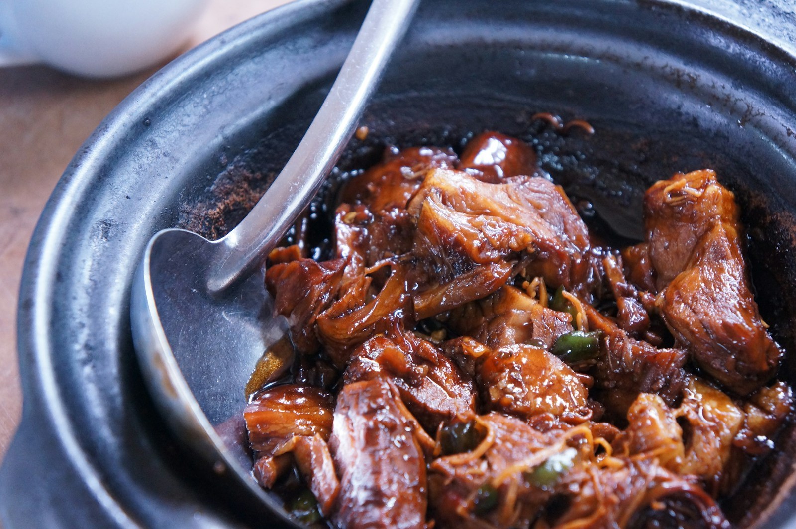 Tender braised dinner with mushrooms in a dark bowl