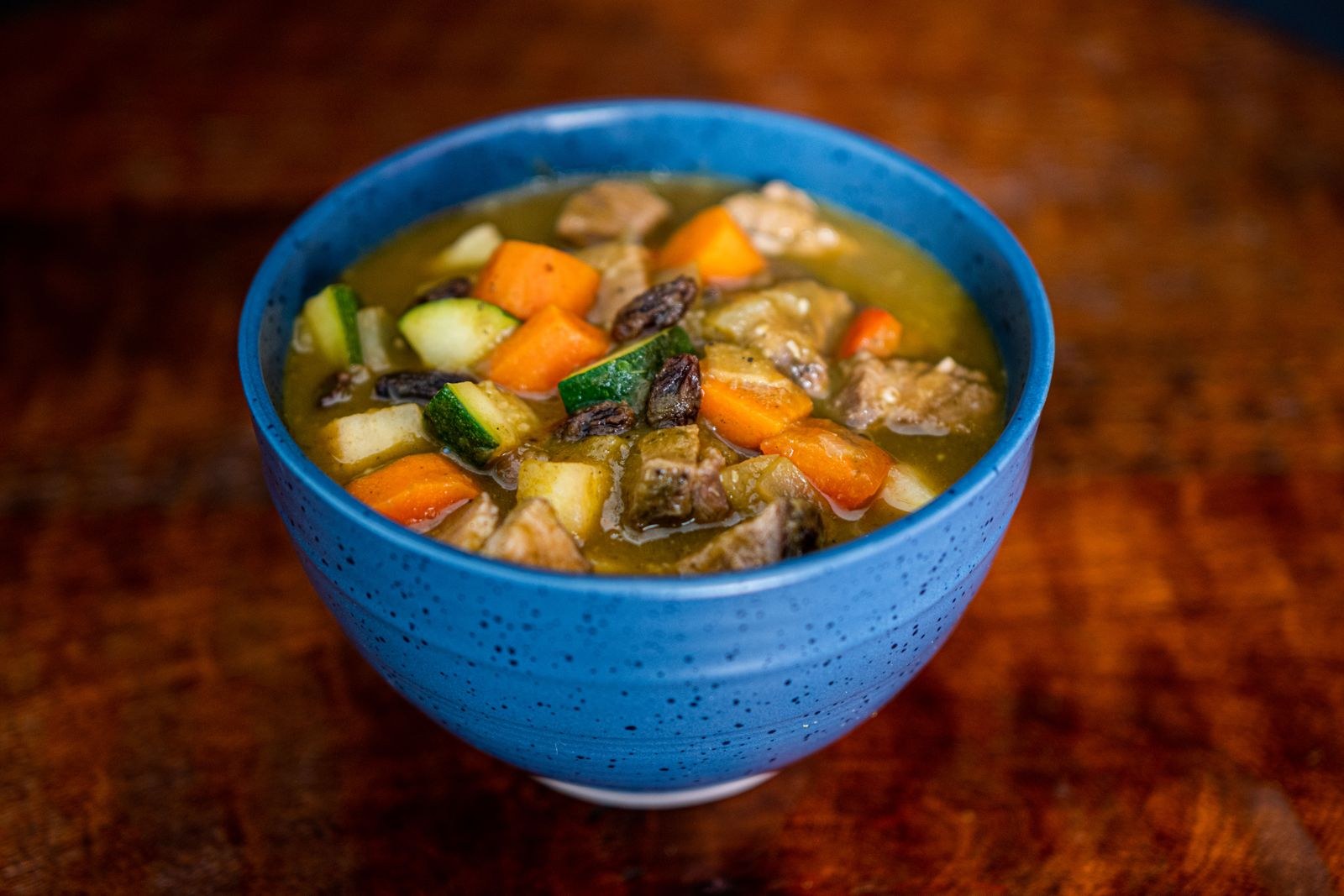 Bowl of old-fashioned beef stew with carrots and potatoes