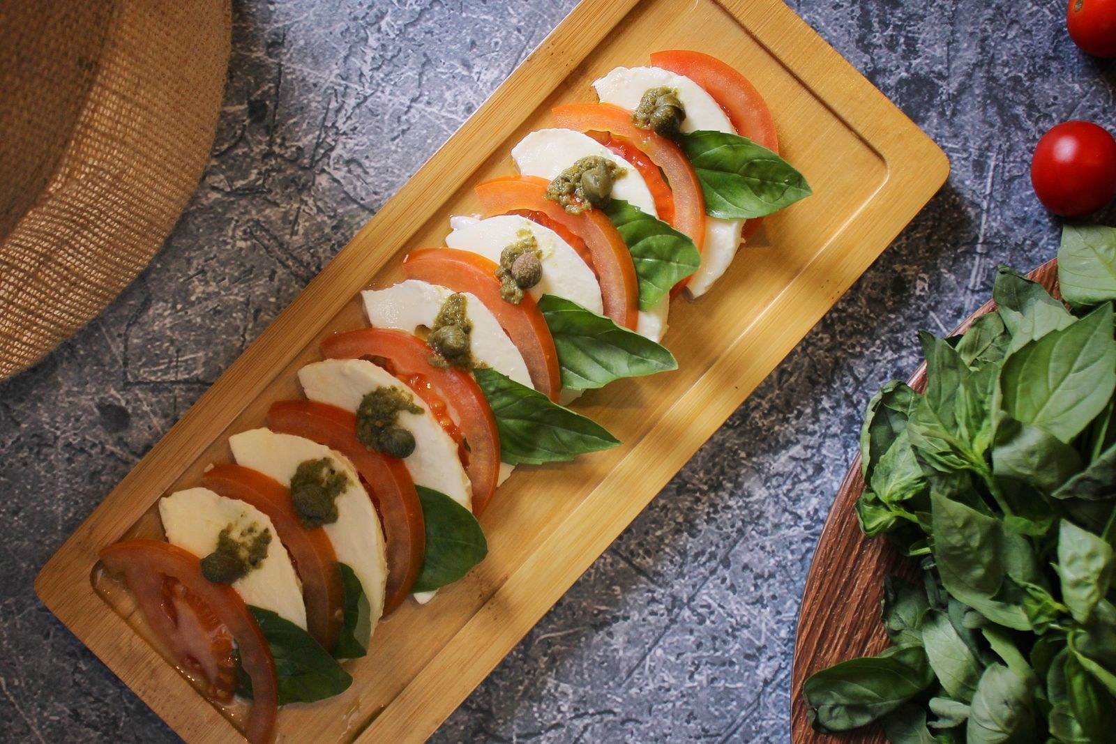 Sliced mozzarella and tomatoes for caprese