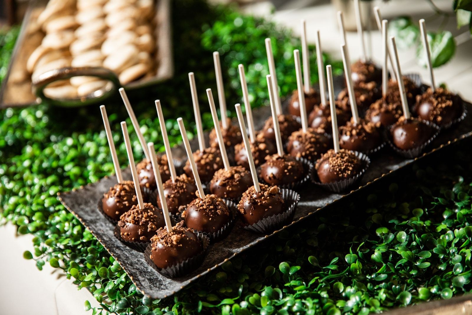 Christmas cake pops standing in rows on a serving board
