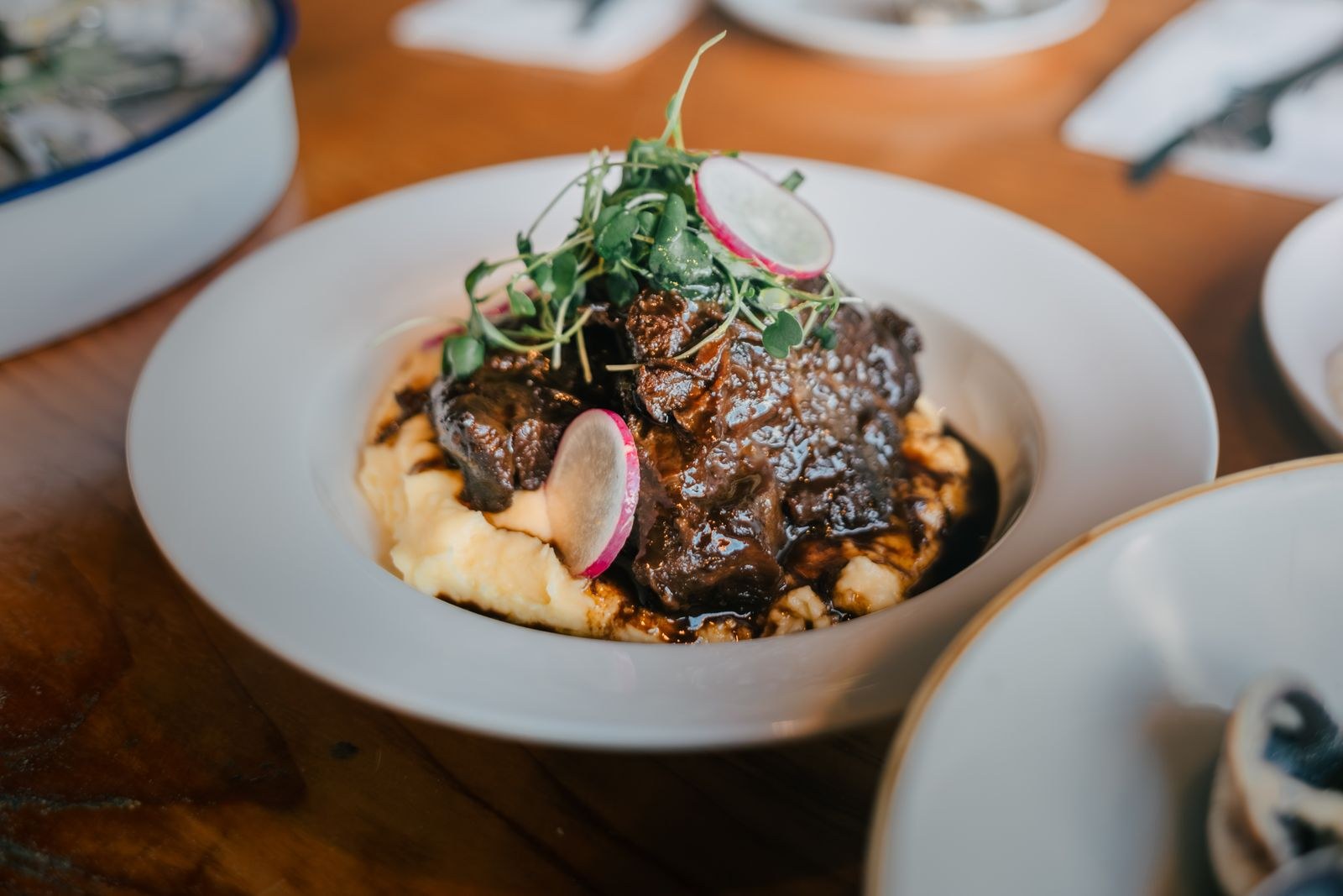 Gravy and tender meat spooned over mashed potatoes