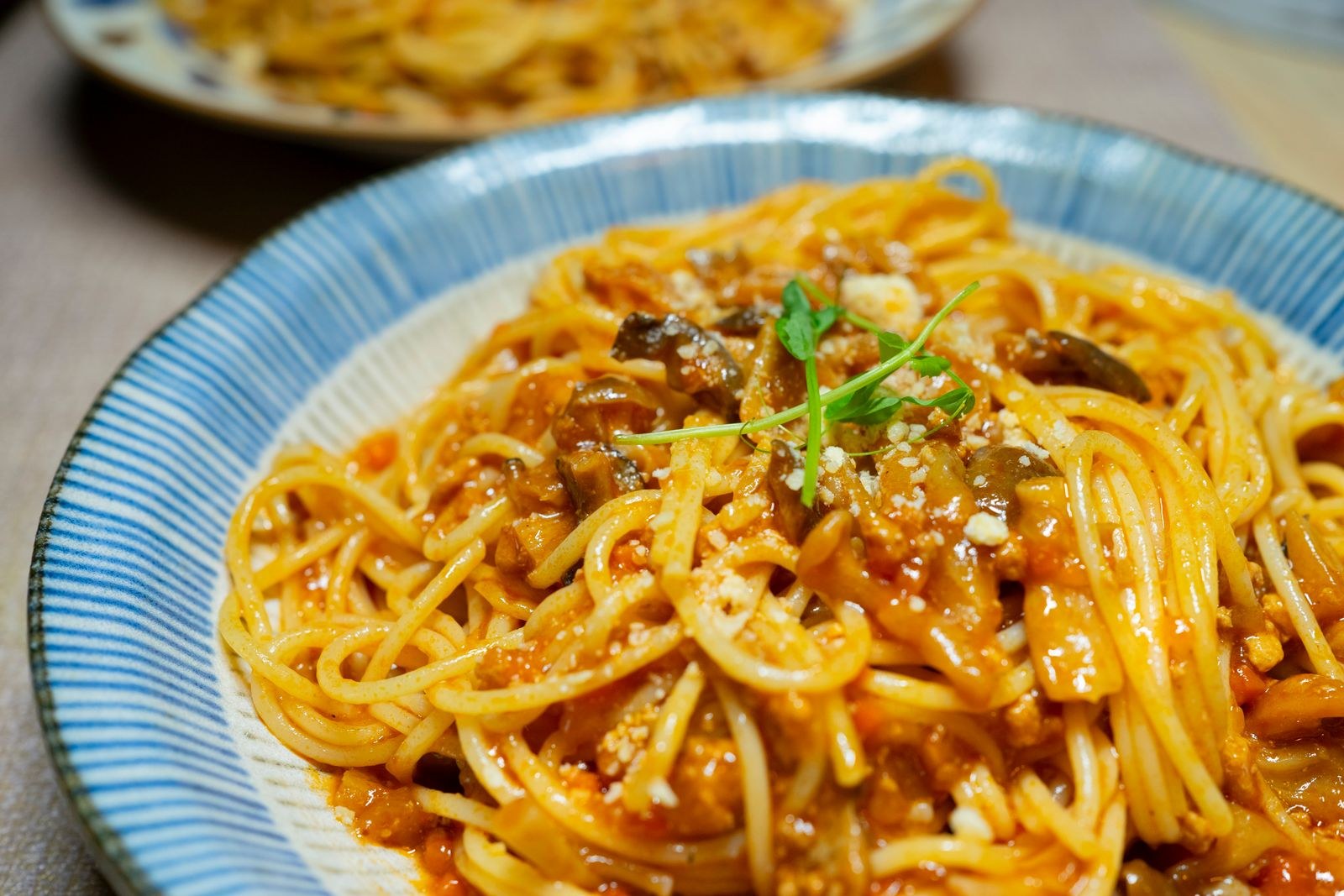 Plate of reheated spaghetti in tomato sauce