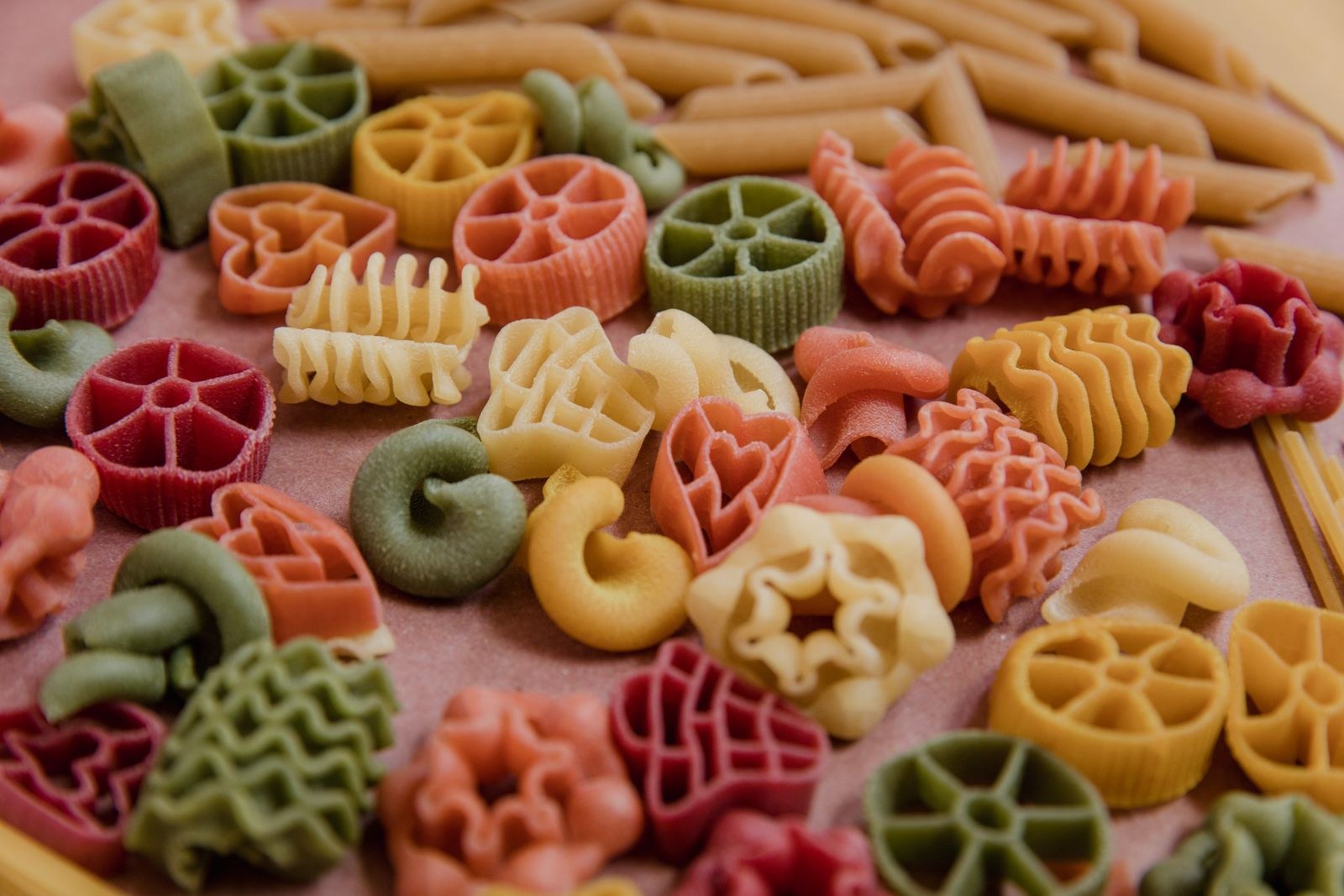 Colorful dry pasta in different shapes