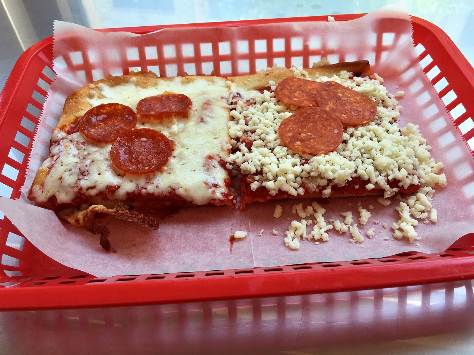 Ohio Valley square slices with cold cheese and pepperoni added after baking