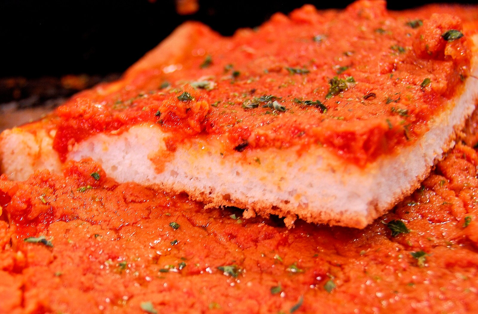Thick Sicilian sfincione with tomato, onion and breadcrumb topping
