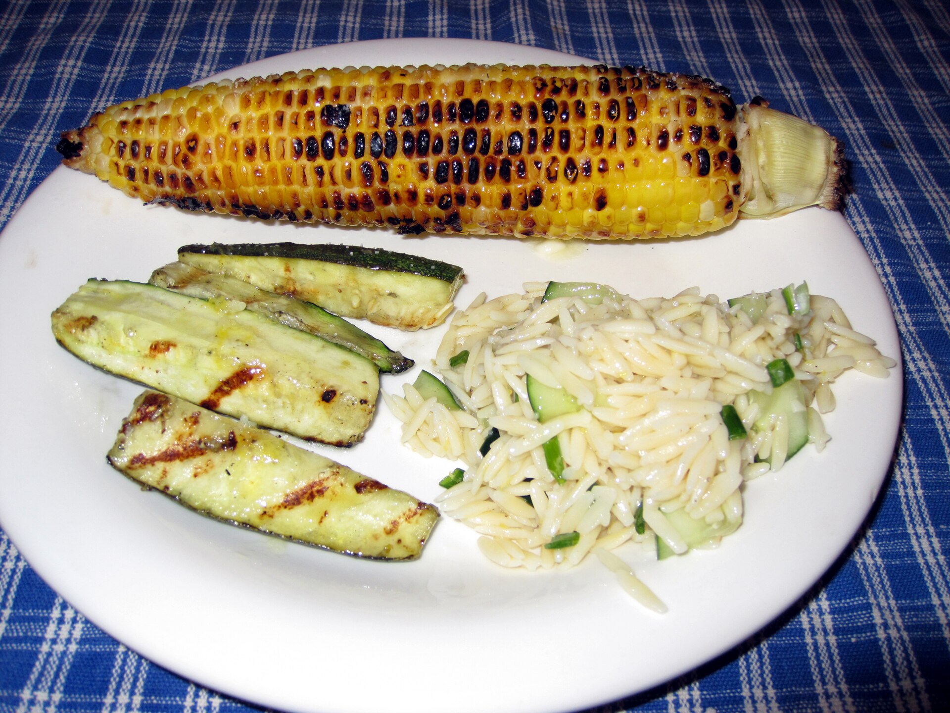 Lemon pasta salad with grilled zucchini on a plate