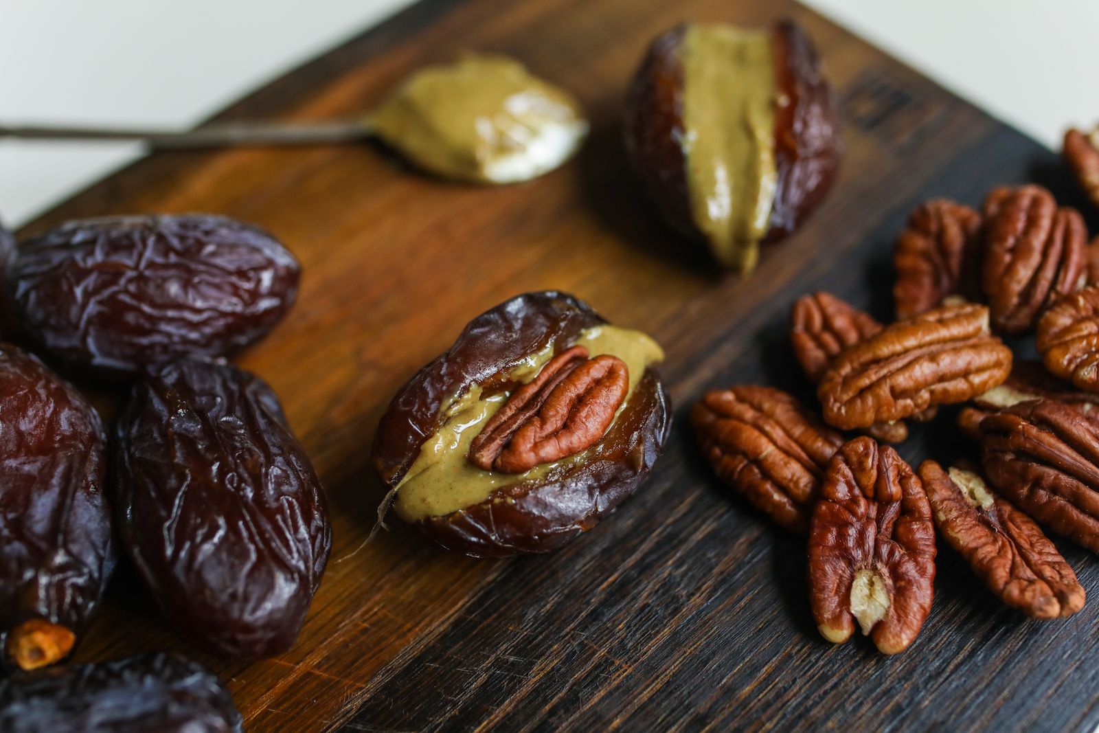 Medjool fruit and pecans on a wooden board