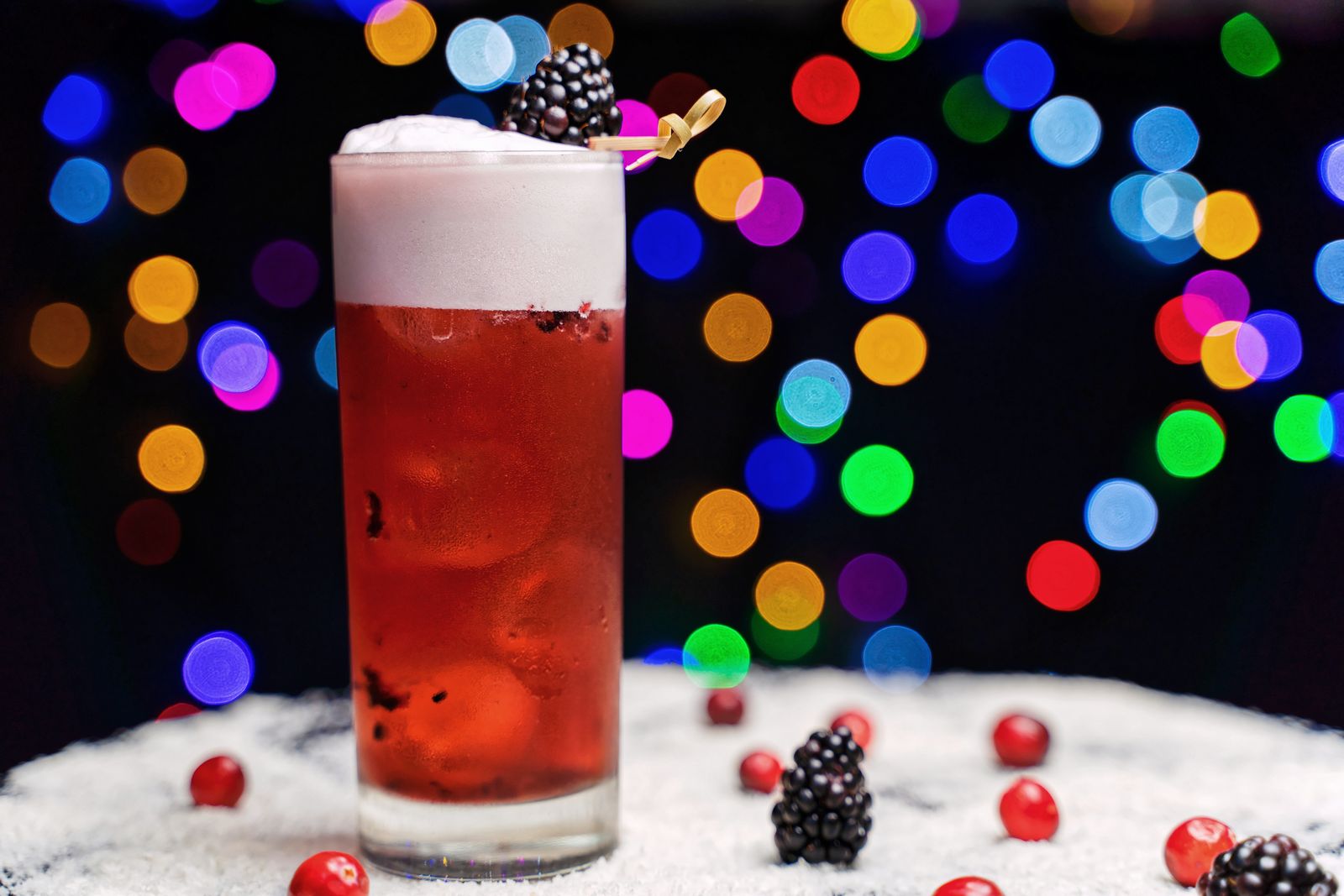 Red cranberry splash drink with a frothy foam top