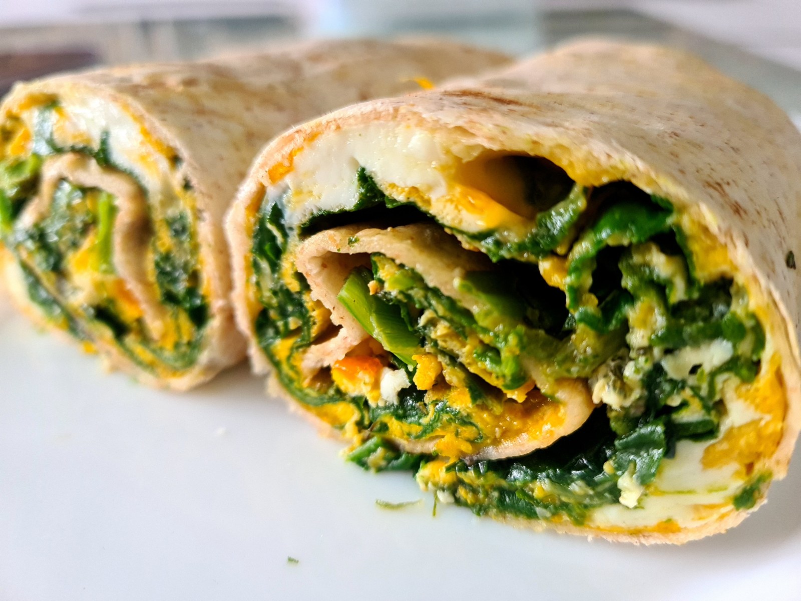 Spinach tortilla wraps sliced in half