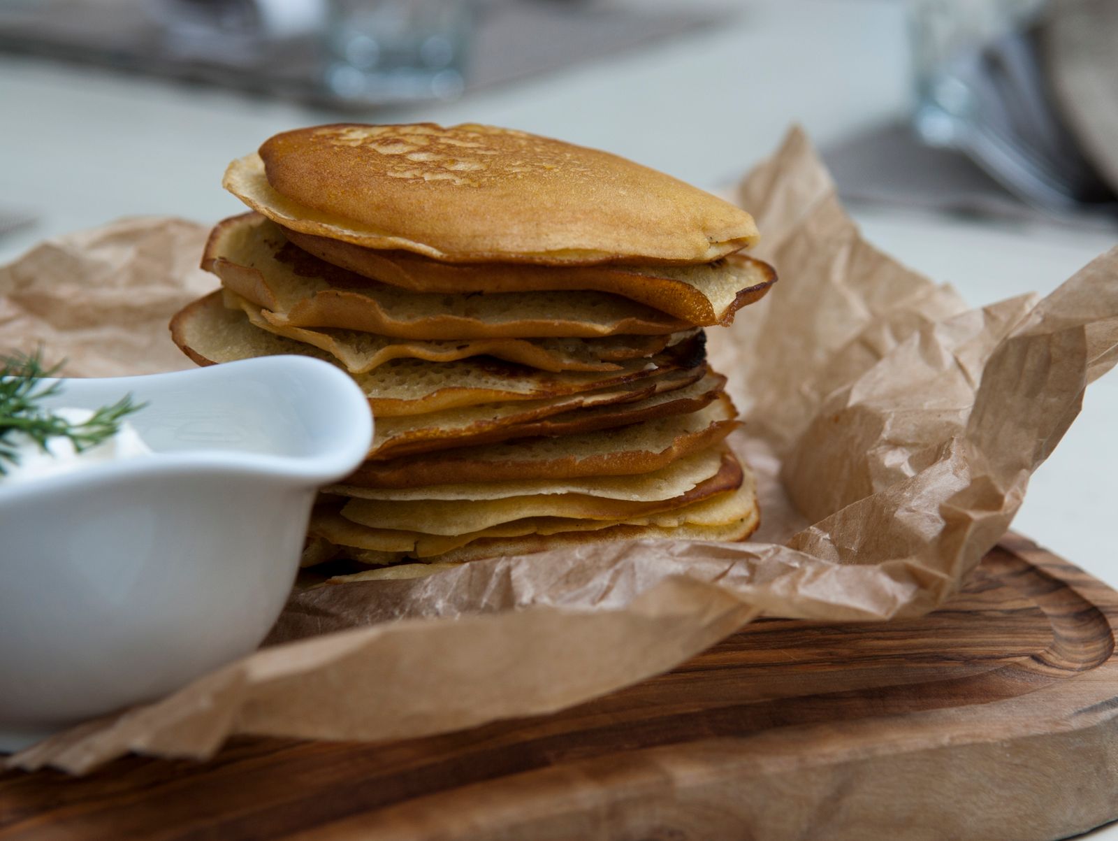A stack of golden cornmeal johnnycakes on a plate