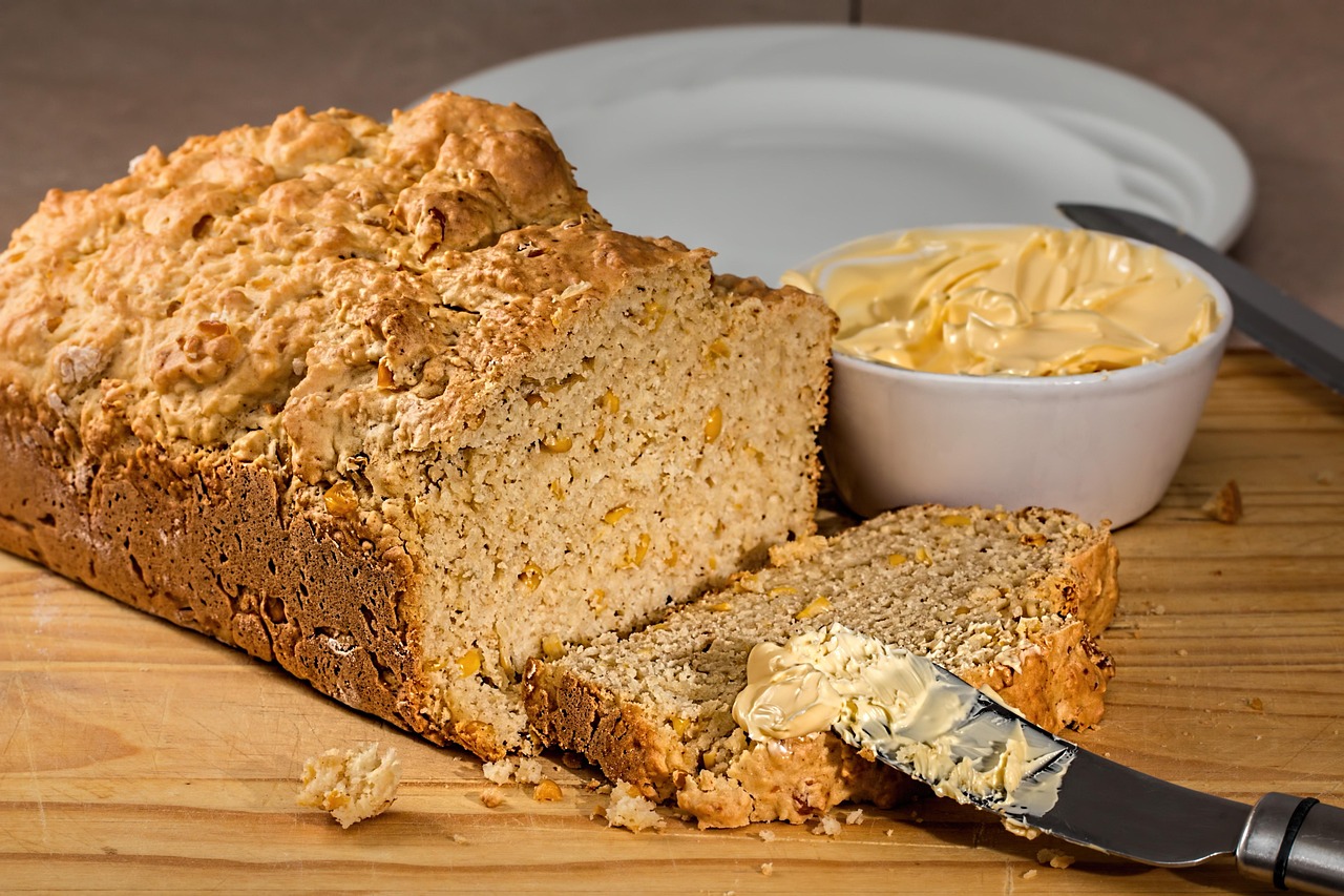 Cornbread recipes for leftovers: a loaf of corn bread with slices on a board