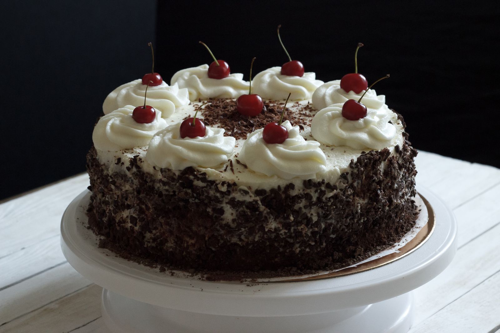 Chocolate cakes from Germany: a Black Forest cake with whipped cream and cherries
