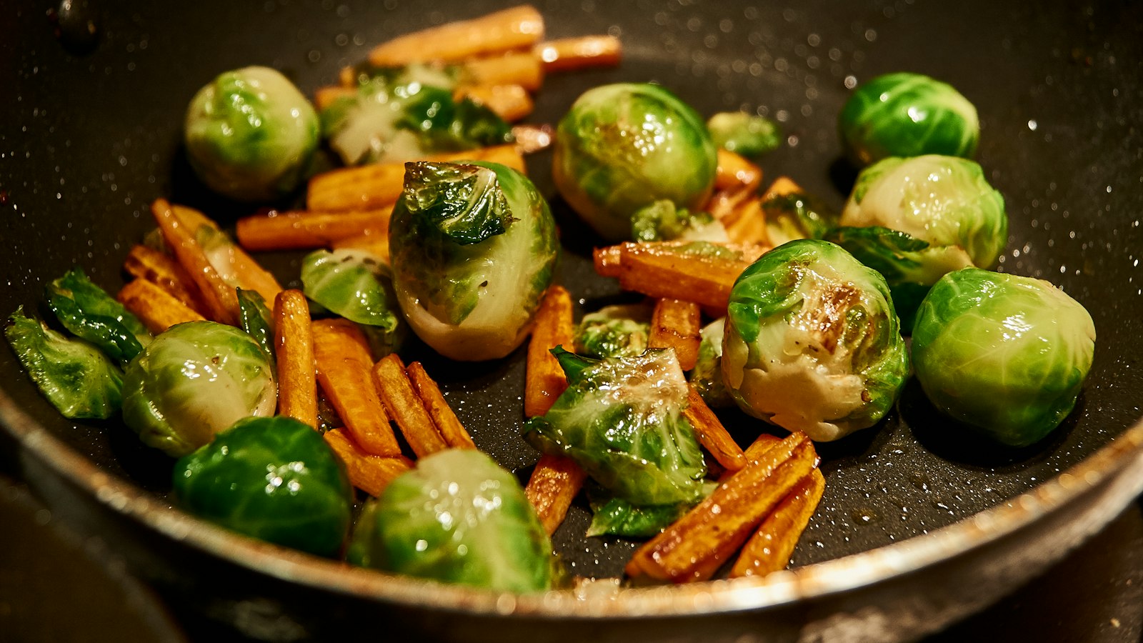 Roasted Brussels sprouts and carrots in a pan