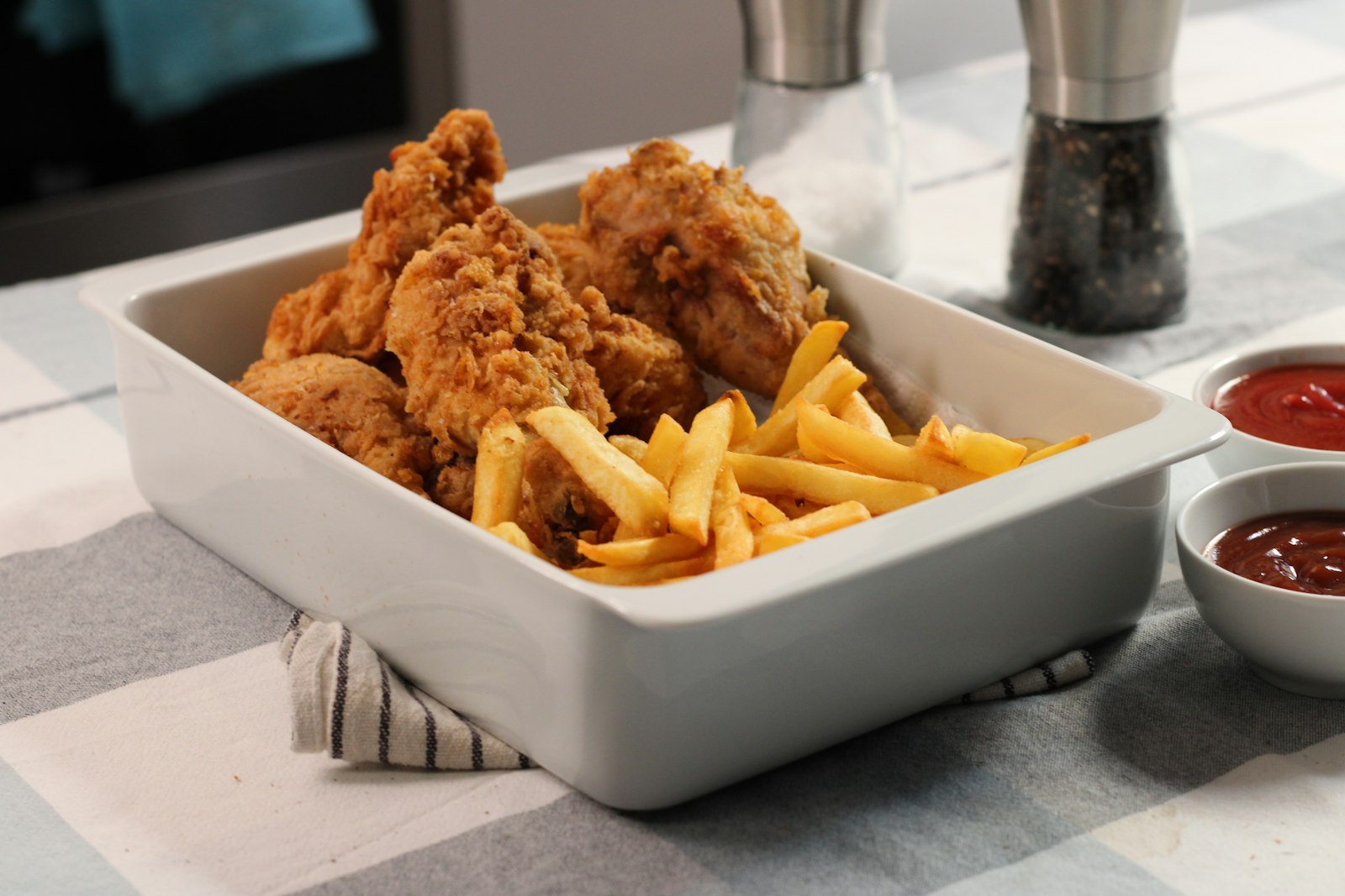 Crispy chicken tenders and fries with dipping sauces