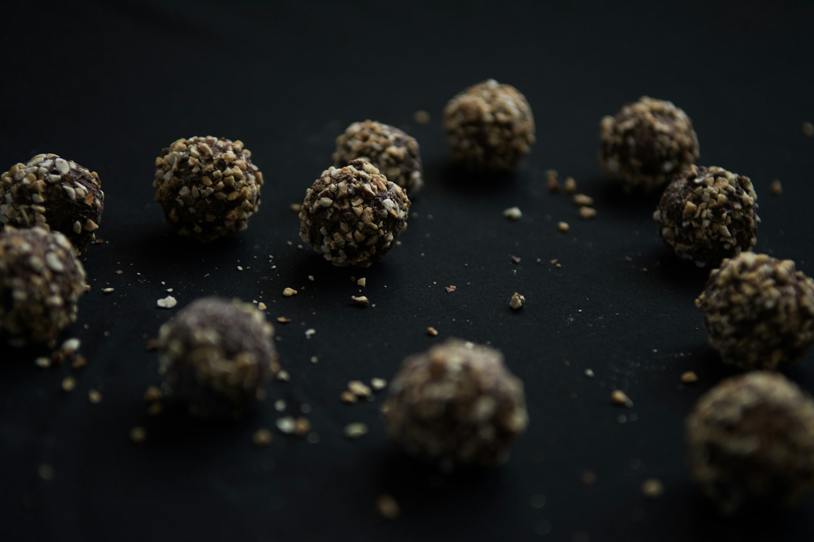 No bake pumpkin protein balls on a dark board
