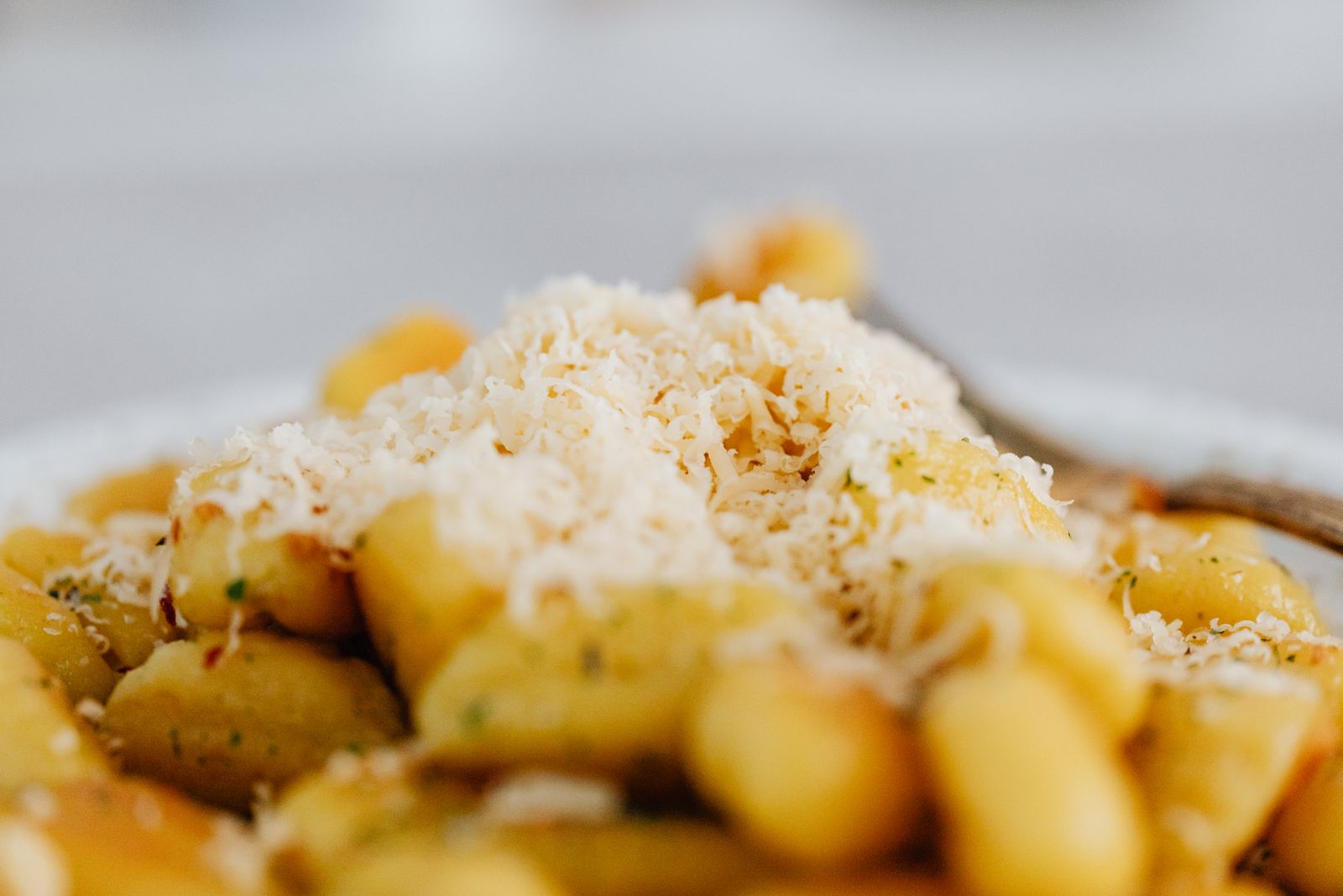 Gnocchi dinners: cheesy baked gnocchi topped with grated Parmesan
