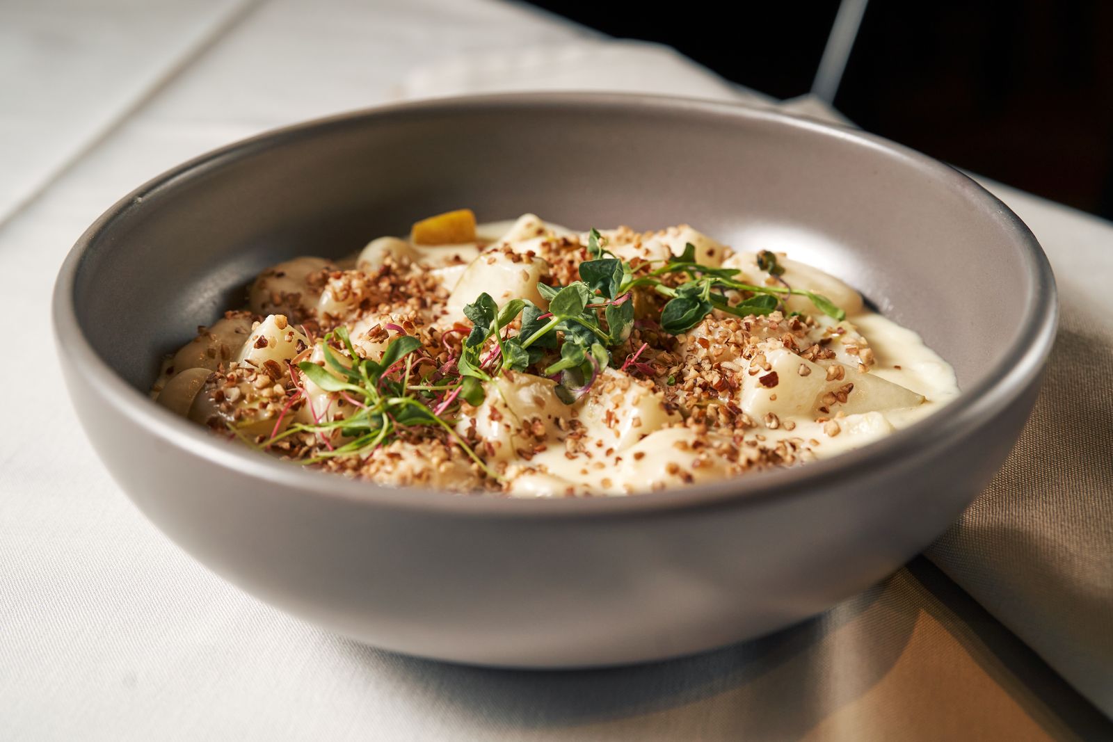 Soft potato pillows in a creamy garlic sauce