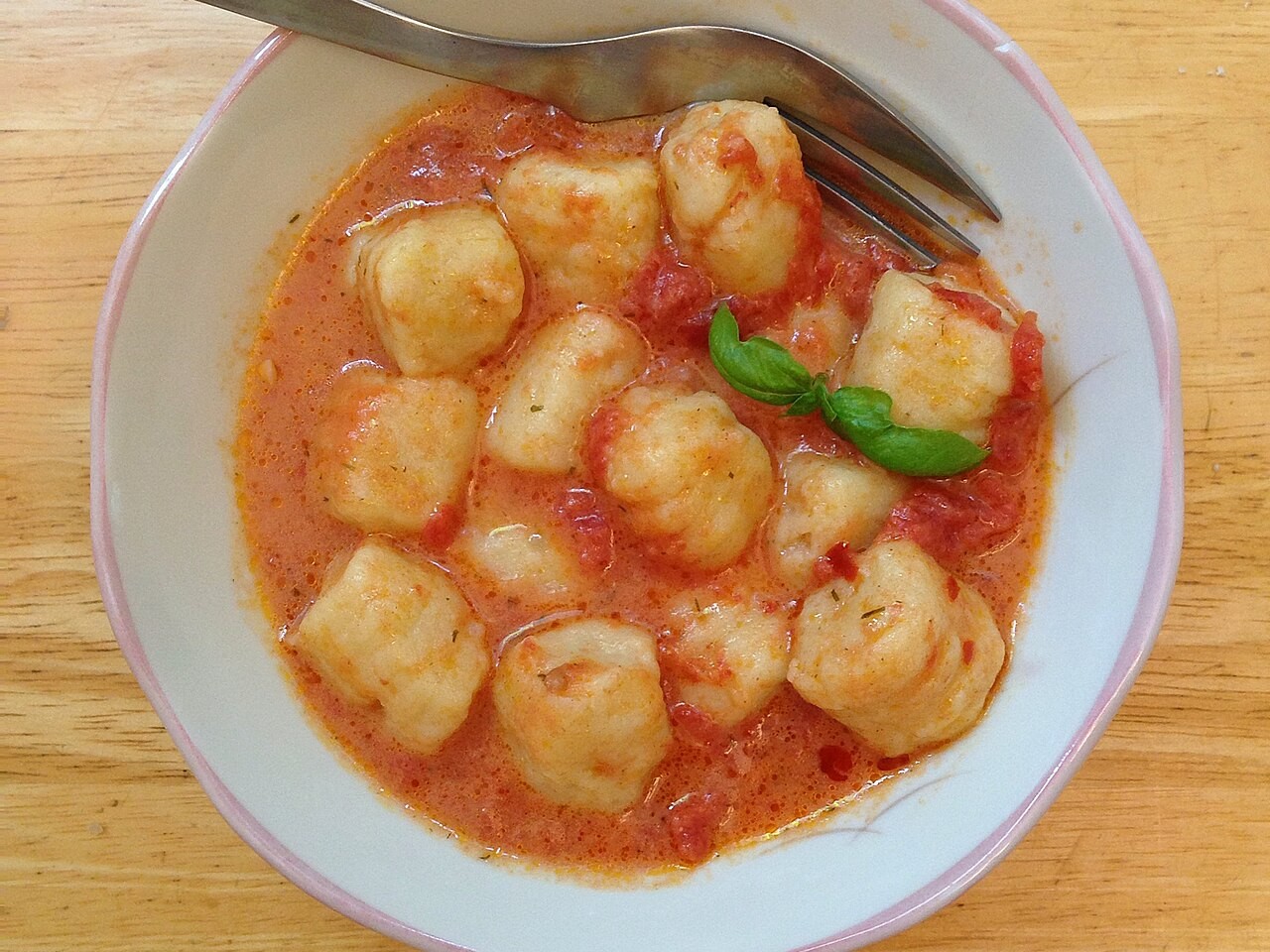 Potato dumplings in a creamy pink tomato sauce with basil