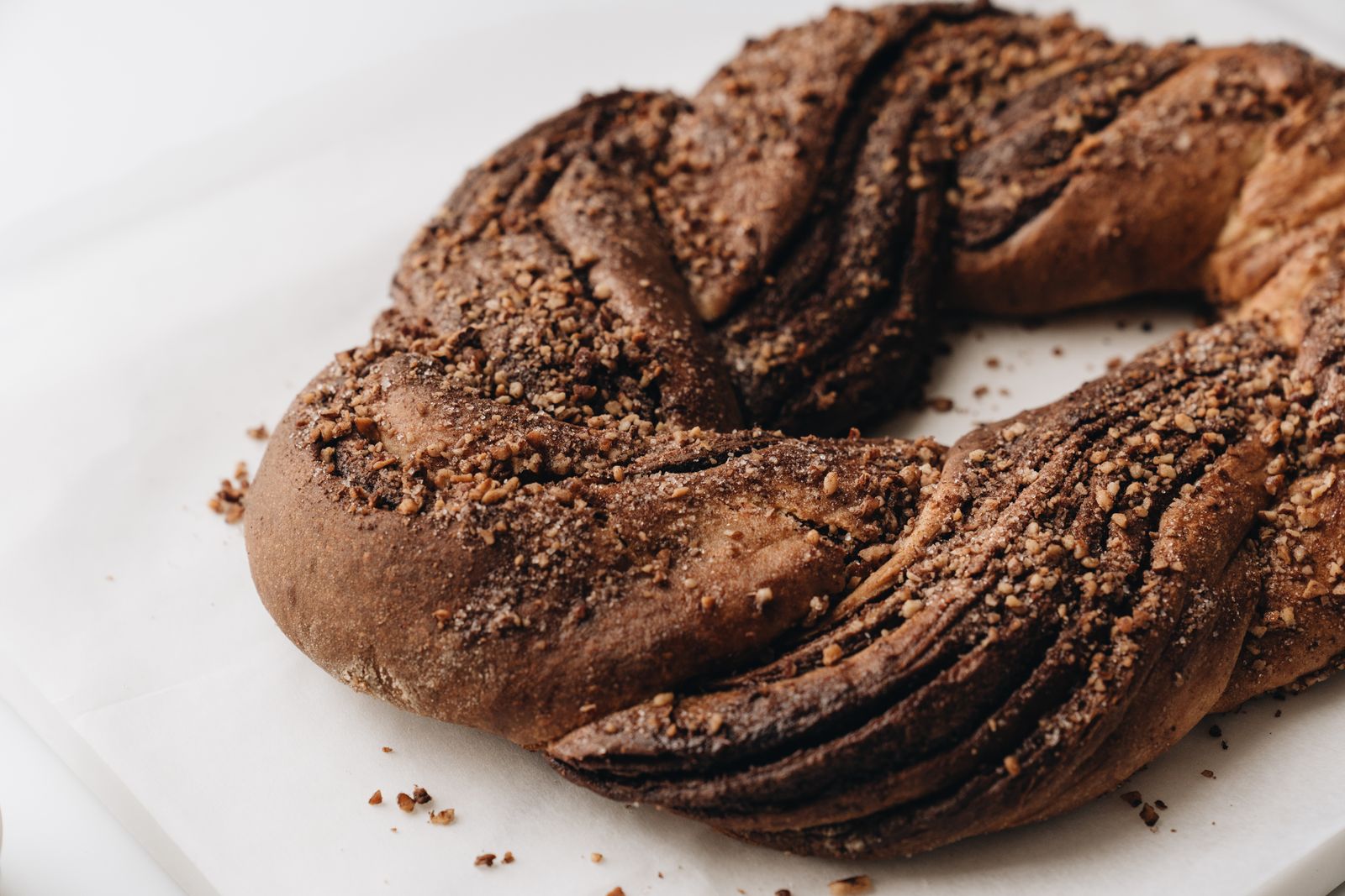 Twisted chocolate babka ring on a white plate, the classic among babka recipes