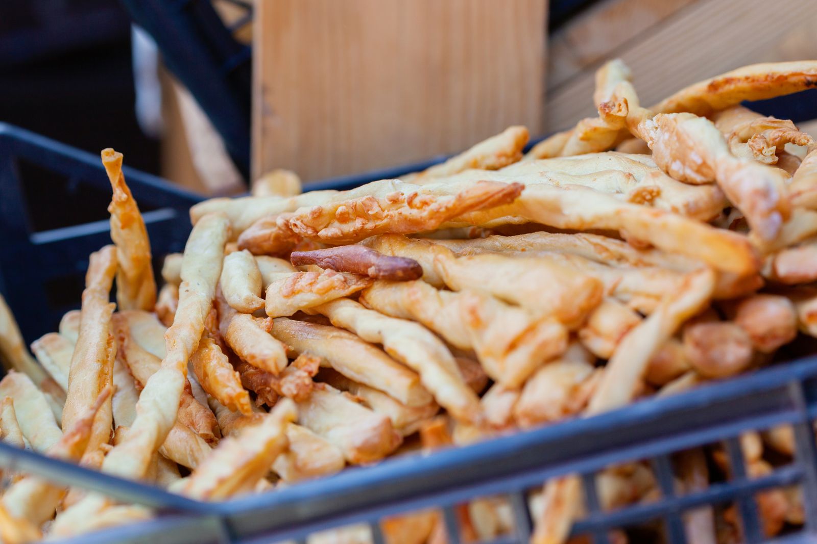 Basket of crisp golden cheese straws