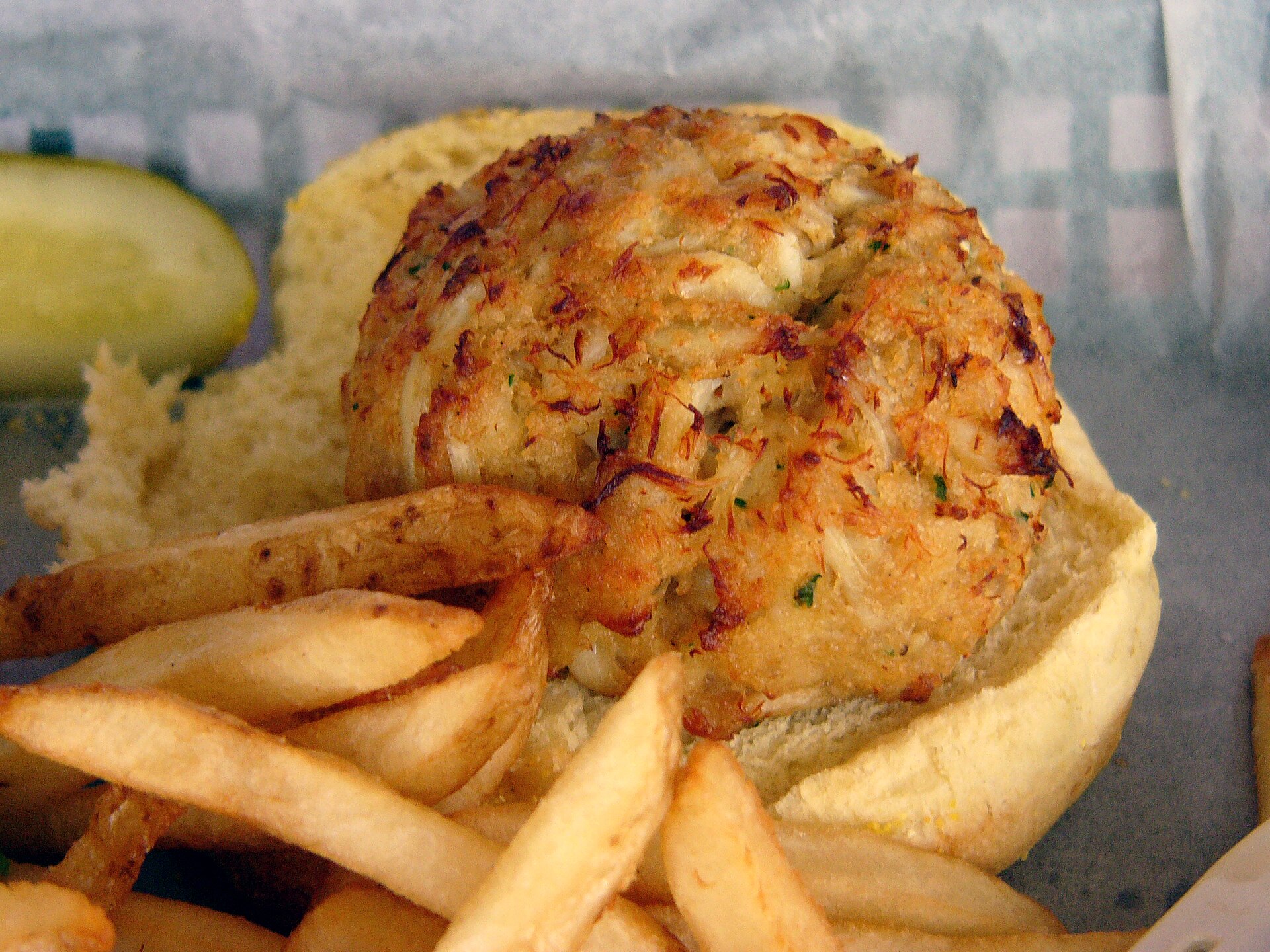 Golden crab cake with fries, riverboat dinner style